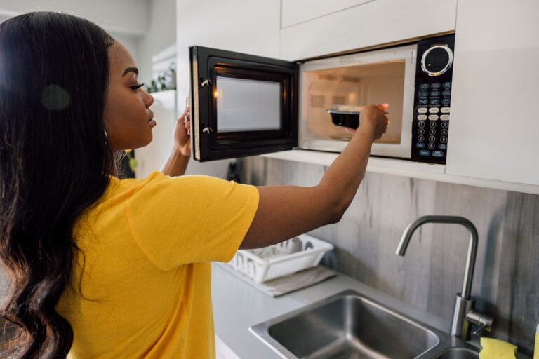 woman microwaving food