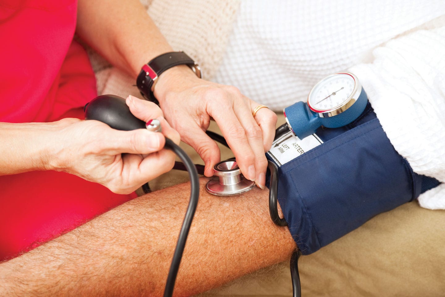 man having blood pressure checked