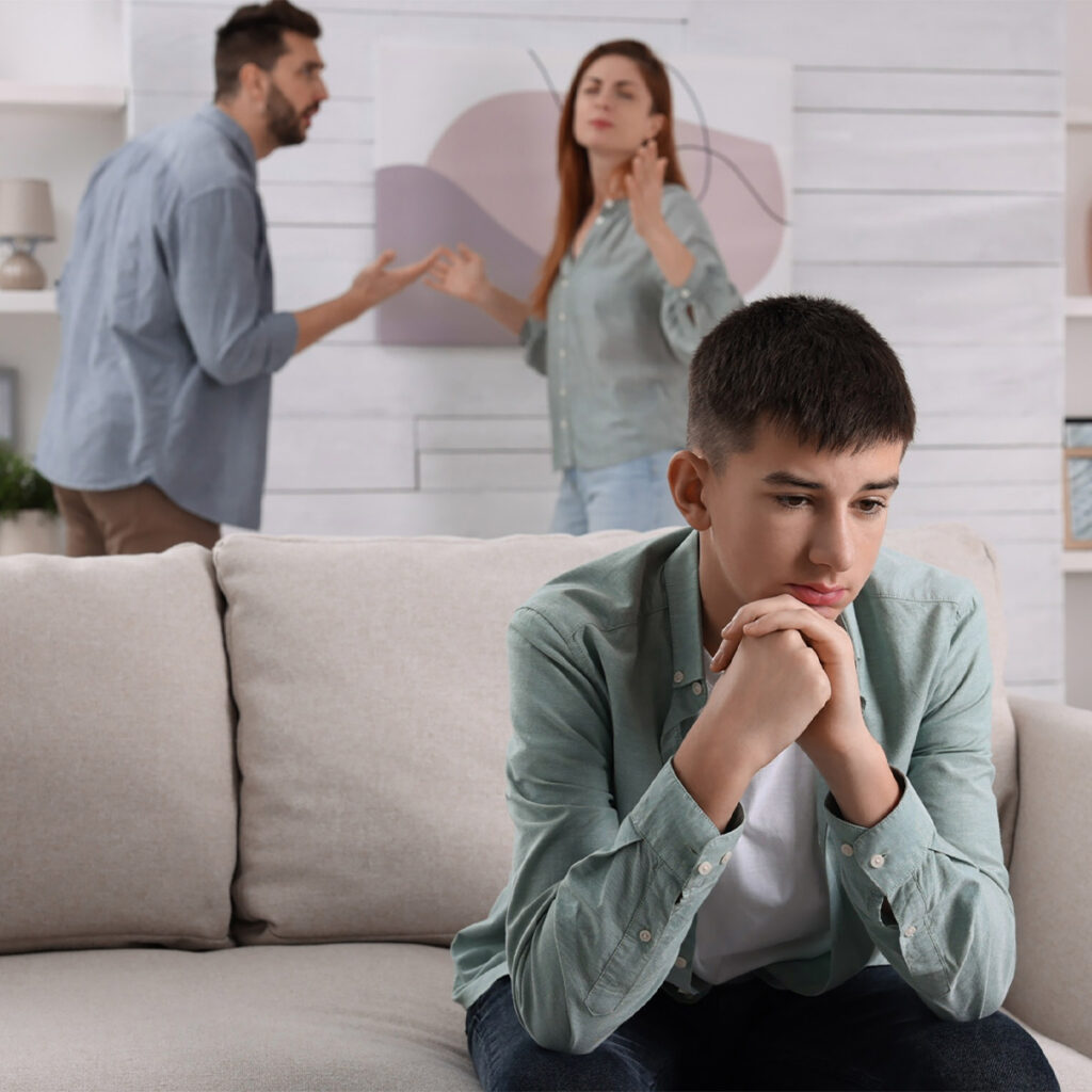 teen listening to parents argue