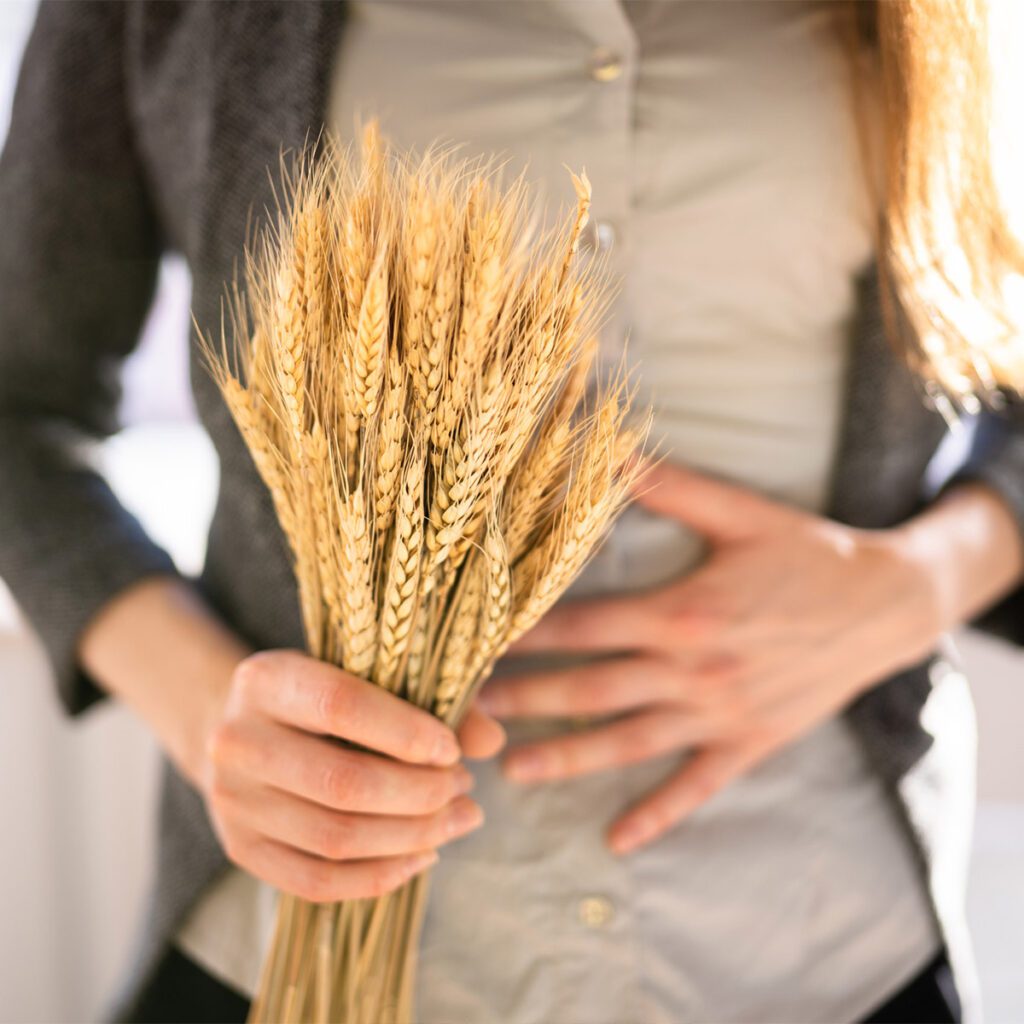 woman with celiac disease holding grain