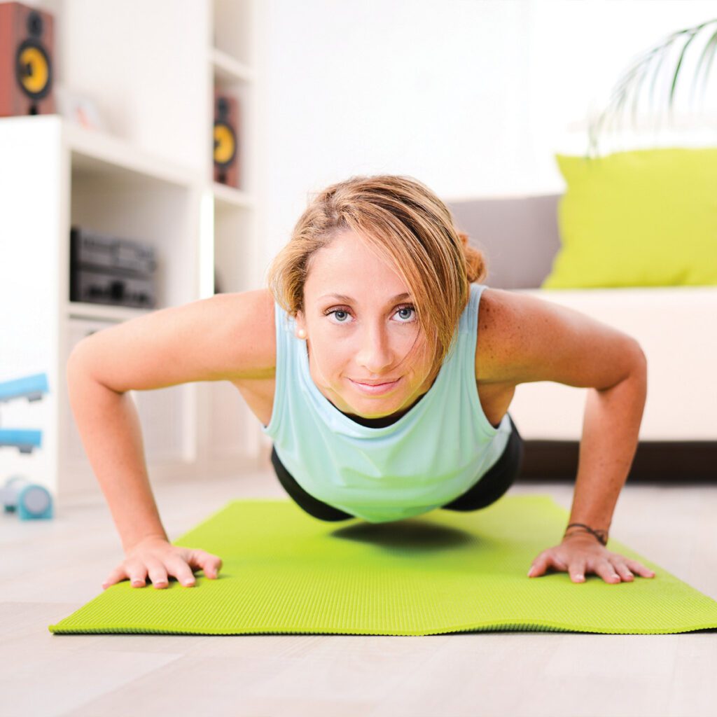 woman doing planks at home
