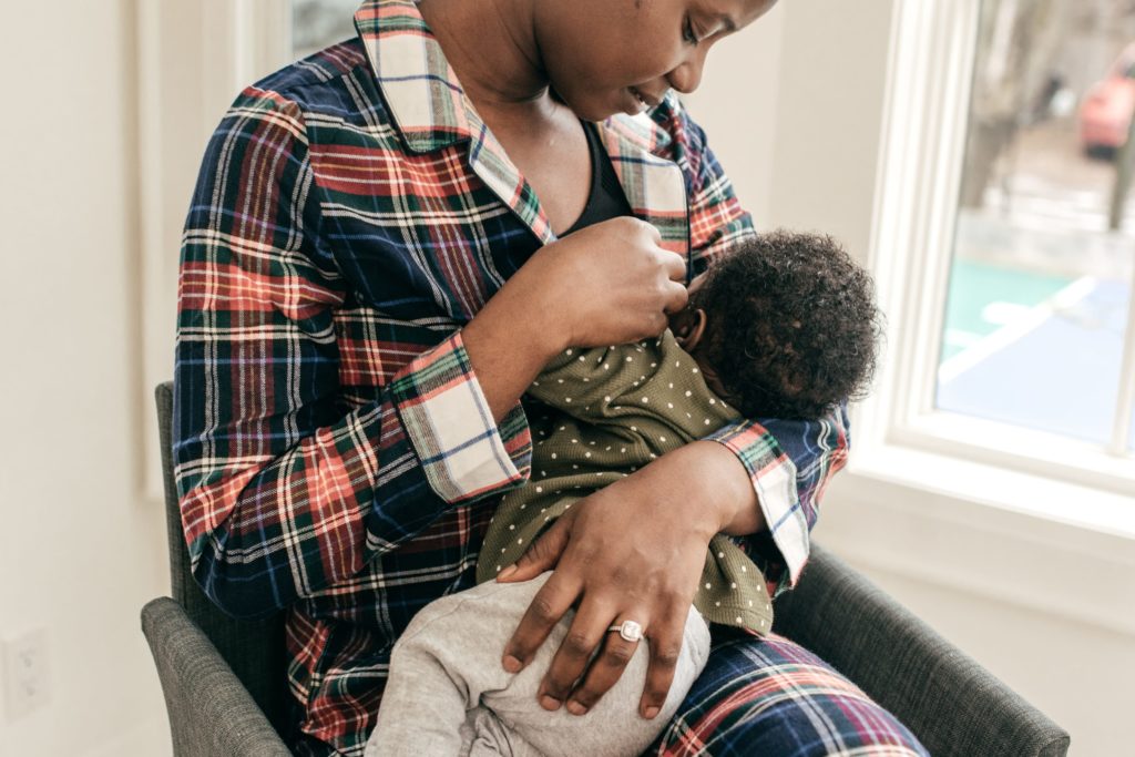African-American mother breastfeeding her infant