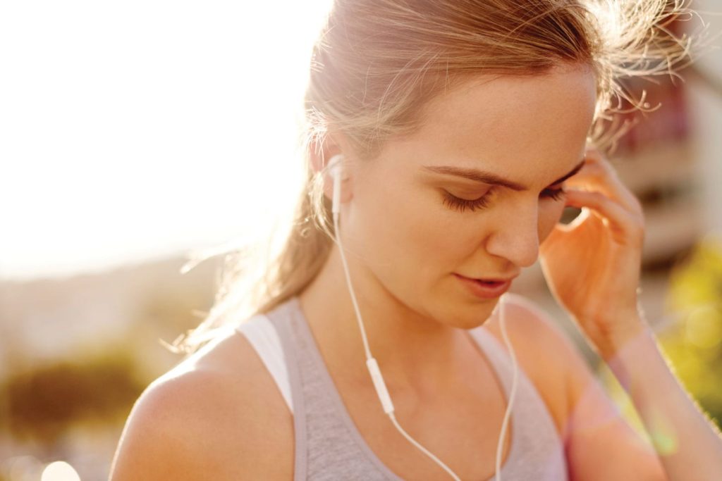 woman listening to music in hot weather