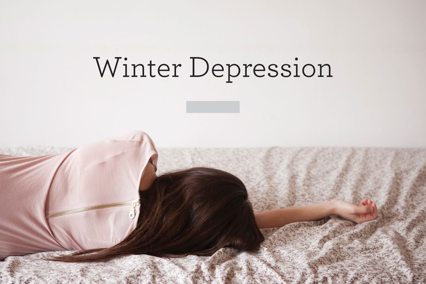 woman lying on bed on side winter depression chattanooga