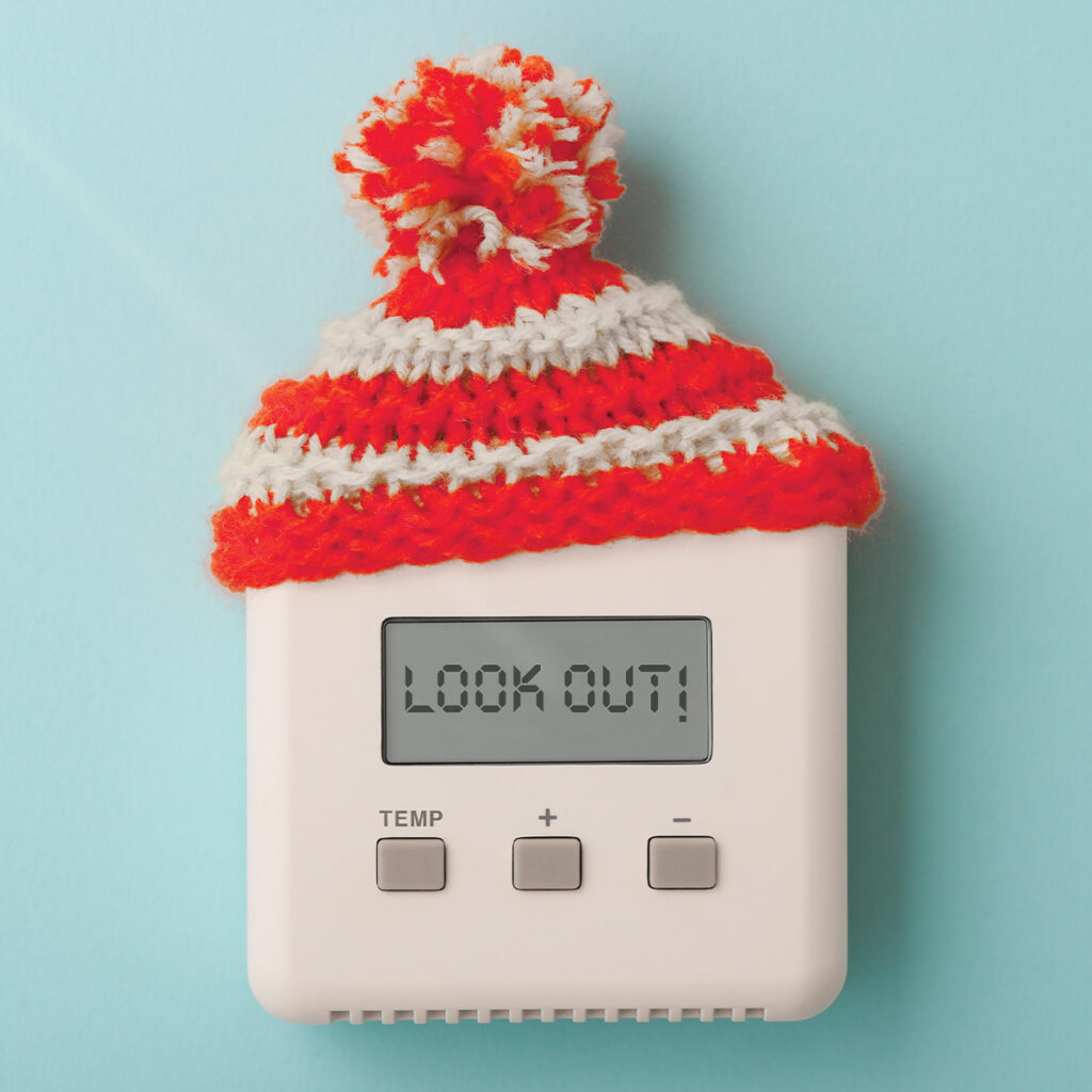 home thermostat with a knitted hat