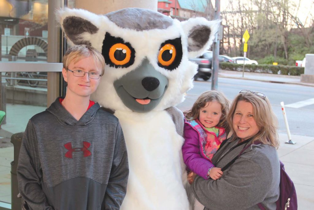 family with costumed lemur mascot at chattanooga zoo
