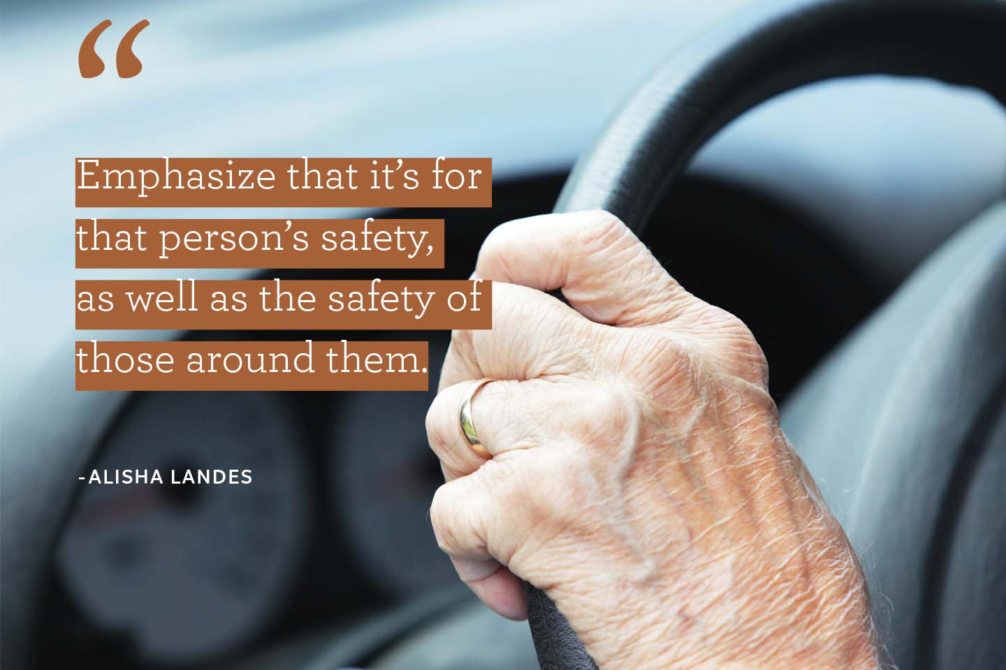 mature adult hand on steering wheel in car safety quote chattanooga