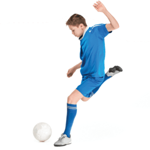 boy in blue soccer uniform kicking ball in chattanooga