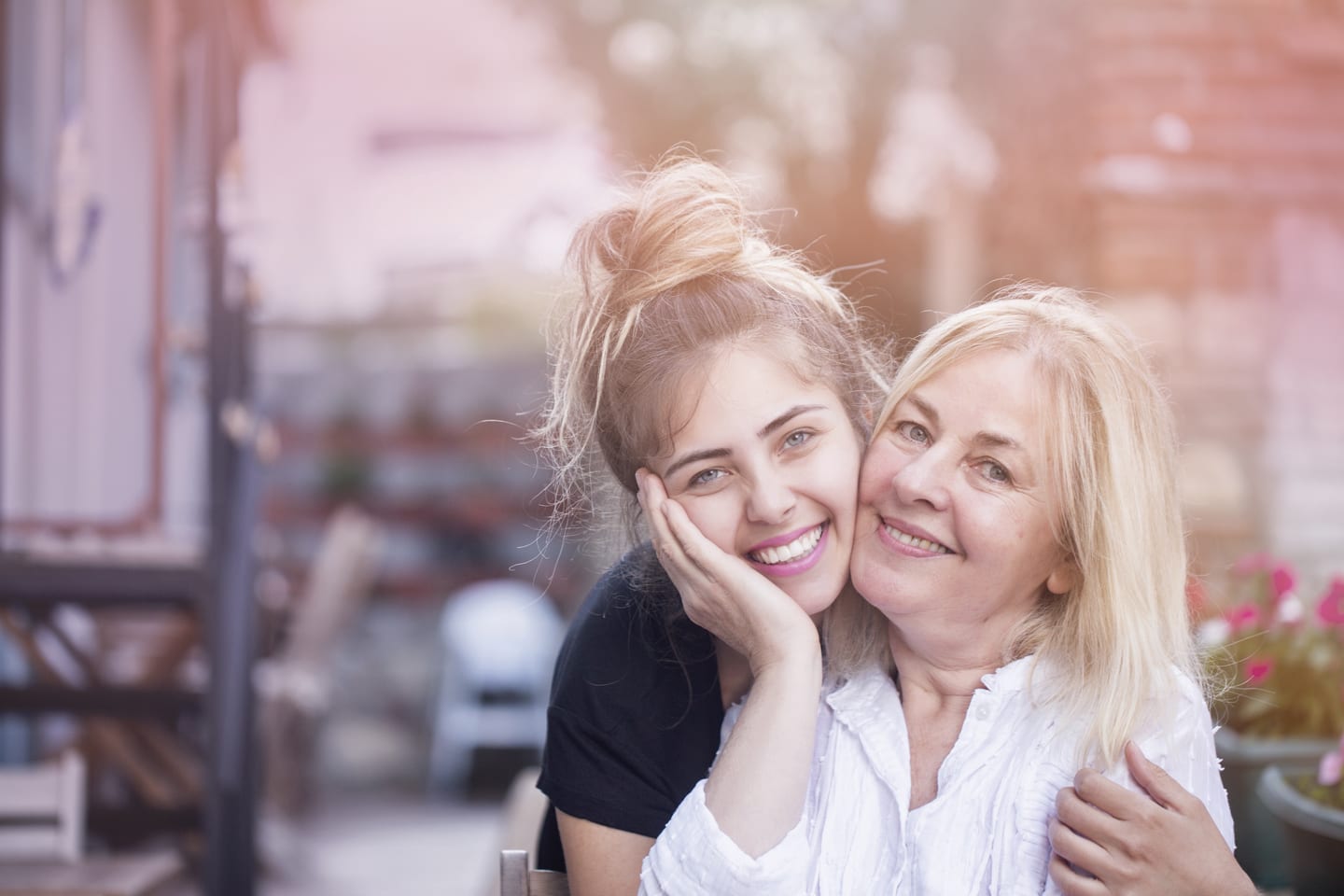 Happy mom and daughter embracing