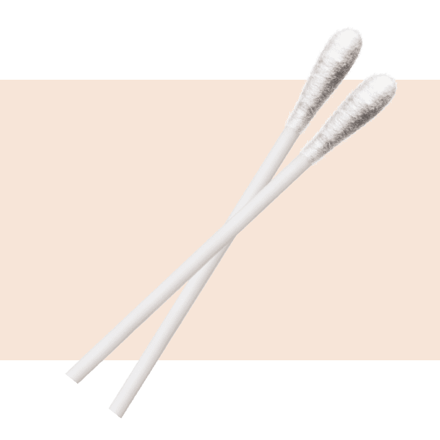 cotton swabs on a light pink background