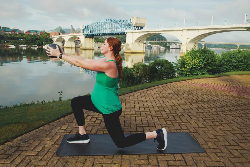 Pregnant woman lunging with core ball in chattanooga