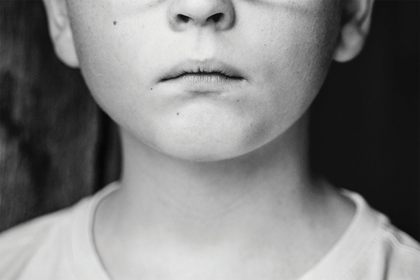 lower half of serious child's face in black and white in chattanooga