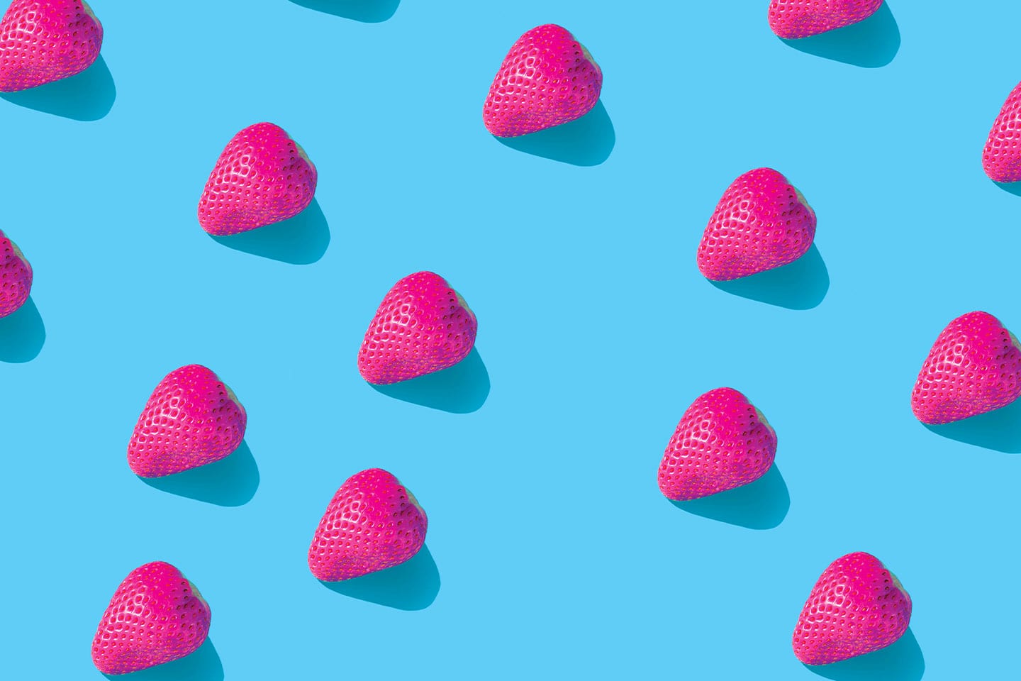 hot pink strawberries on a bright blue background foods that brighten your teeth chattanooga