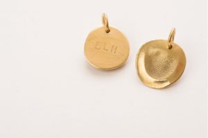 gold necklace pendant with fingerprint and initials mother's day gift guide chattanooga