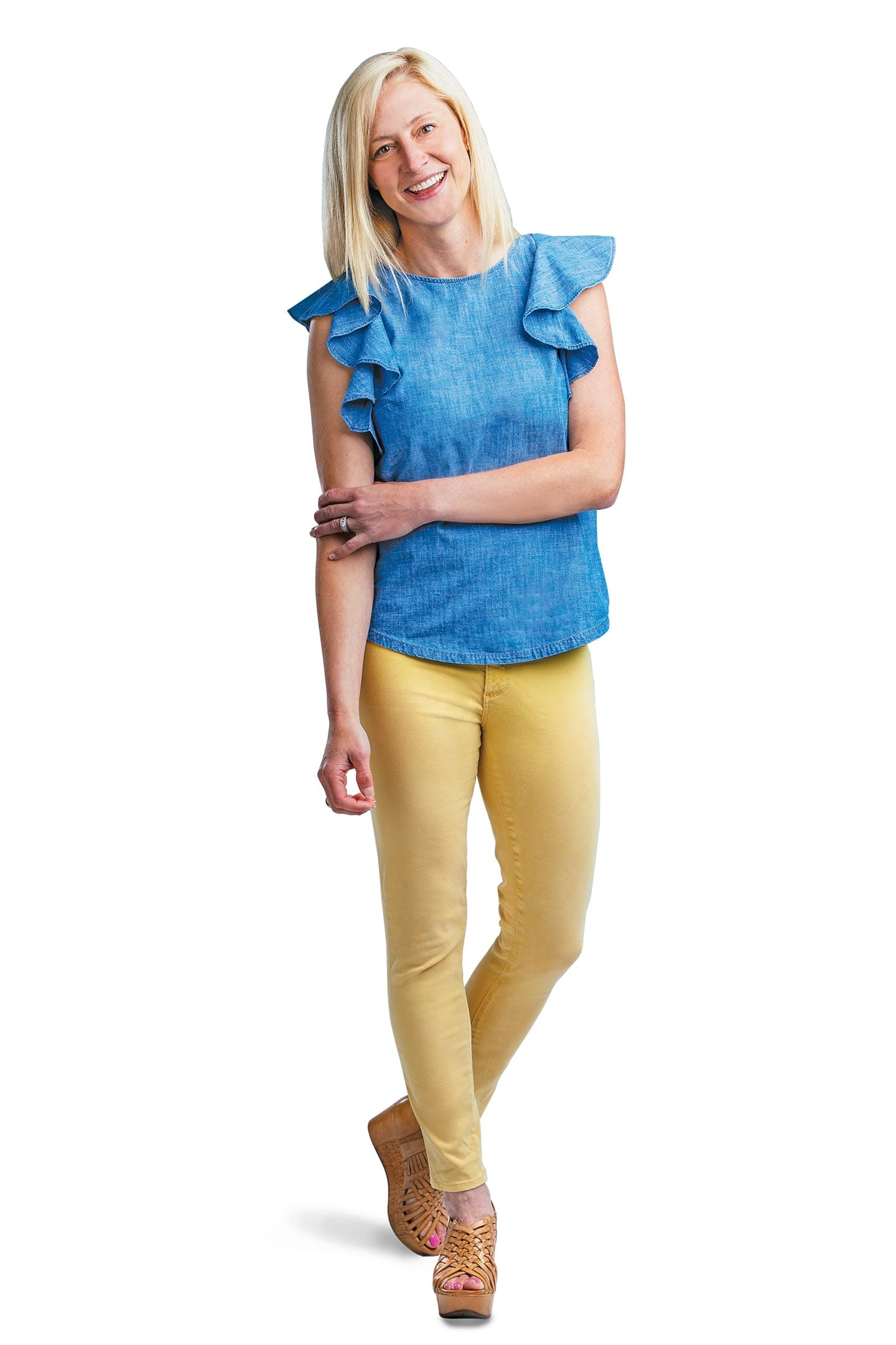 Amy Jo Osborn HealthScope Summer 2019 cover model standing wearing blue blouse and yellow pants in chattanooga