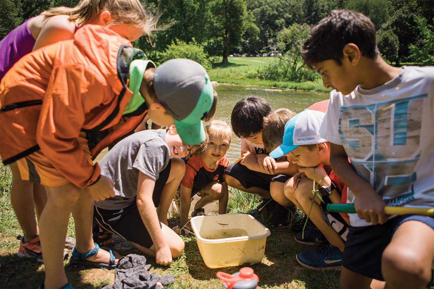 kids outside discovering the natural world at reflection riding arboretum and nature center summer camp