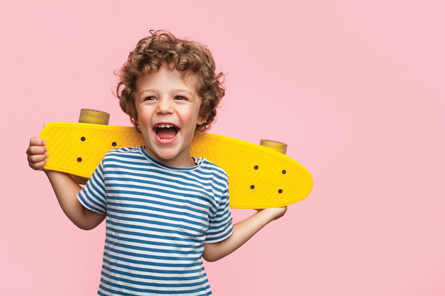 happy little boy with skateboard