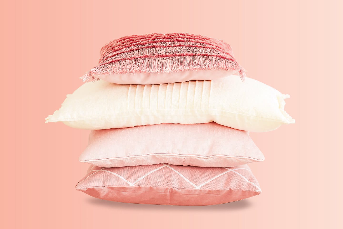 stack of pink pillows