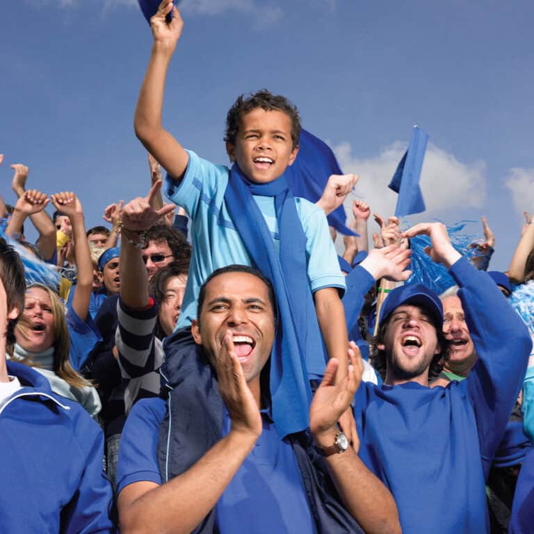 crowd of spectators wearing blue cheering in Chattanooga