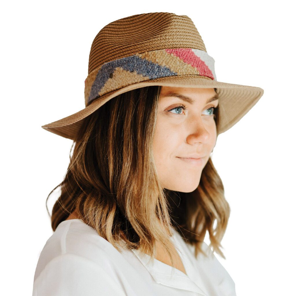 woman with green eyes wearing a panama hat