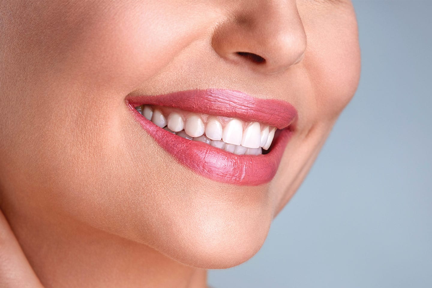 woman smiling with dental implants