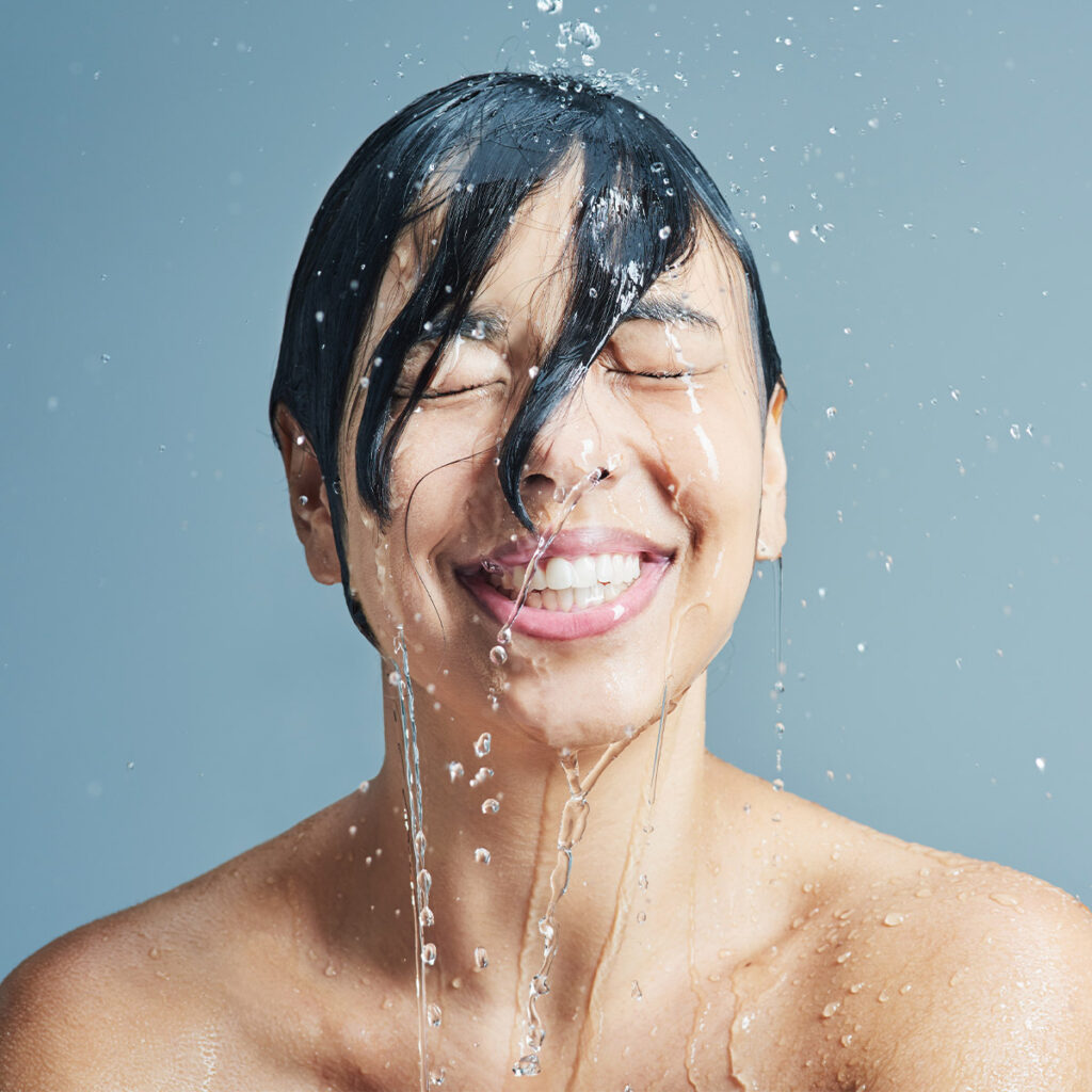 woman with water running down her face