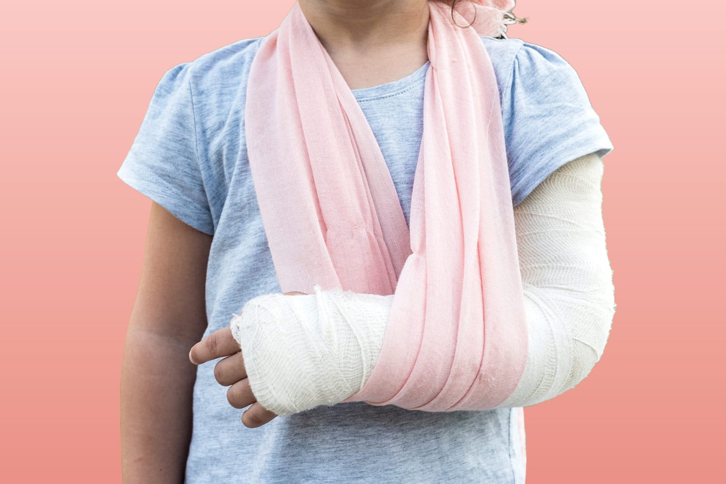little girl with broken arm in pink sling