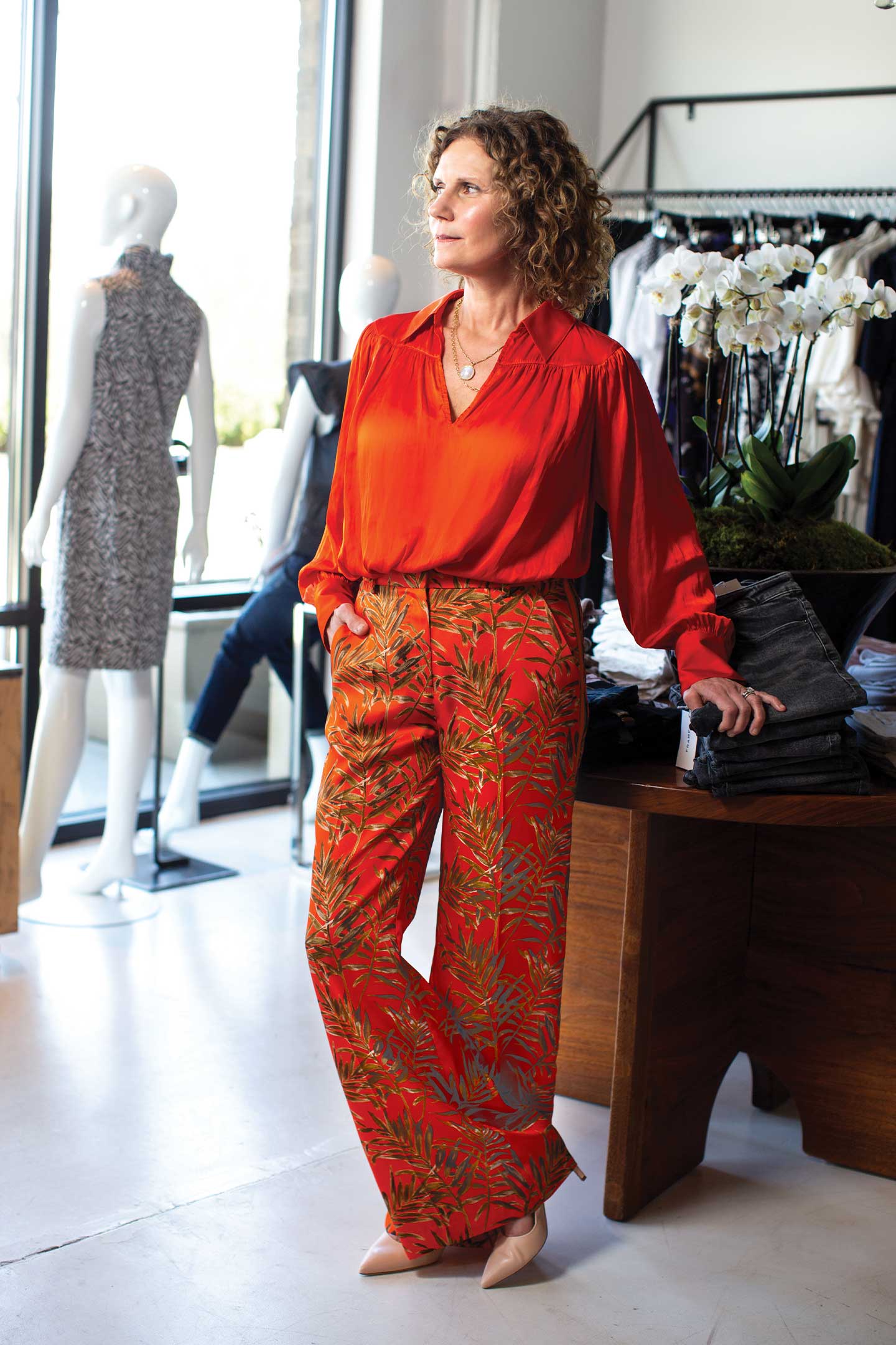 Becky Montgomery modeling palm frond trousers and an orange top from K :: A Boutique by Katherine Roberts