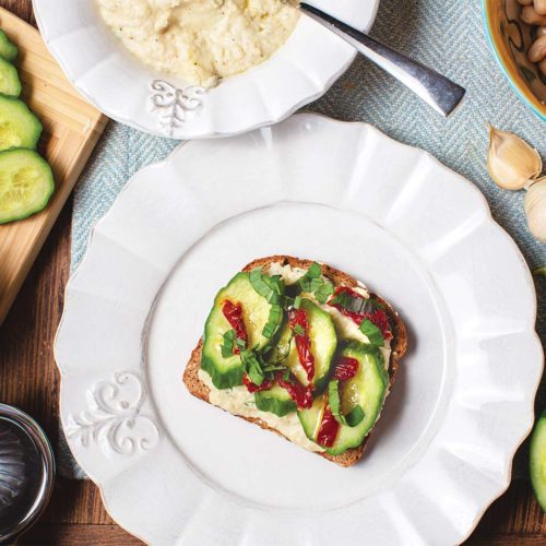 Cucumber and White Bean Toast with sun-dried tomatoes on top