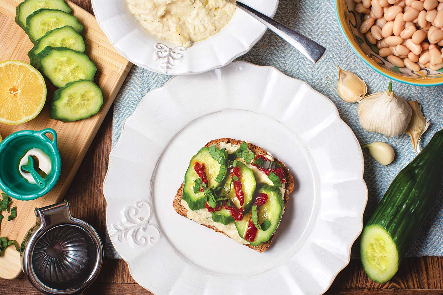 Cucumber and White Bean Toast with sun-dried tomatoes on top