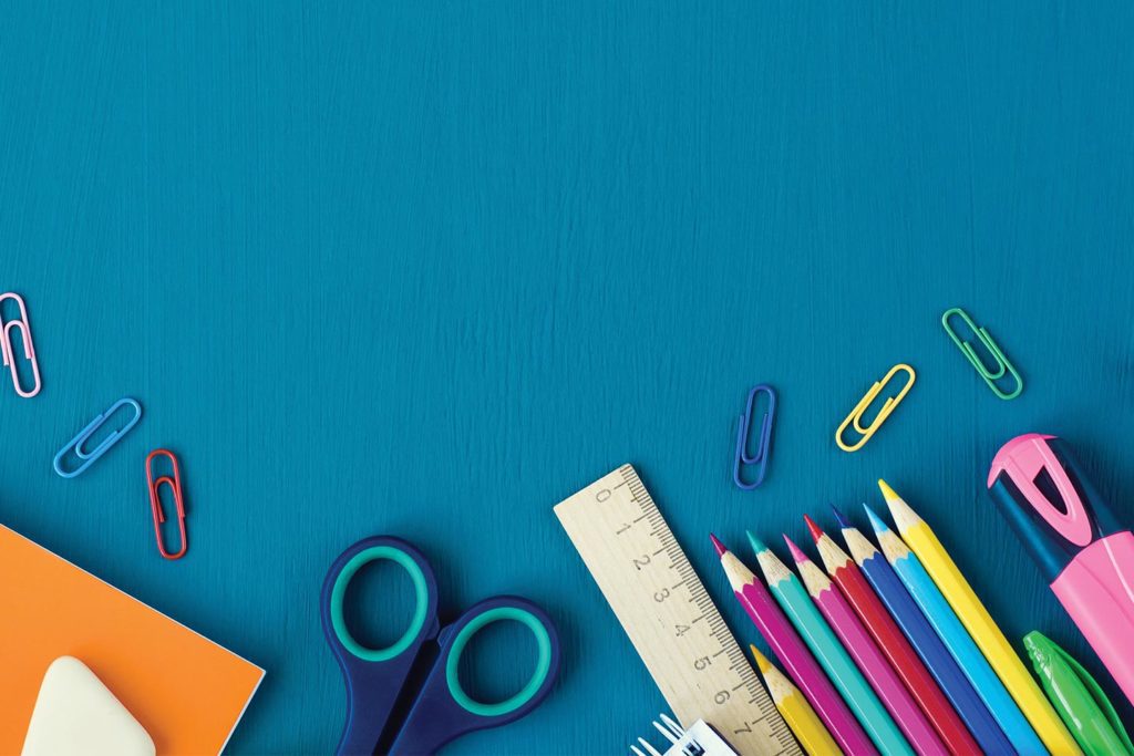 school supplies on a blue background