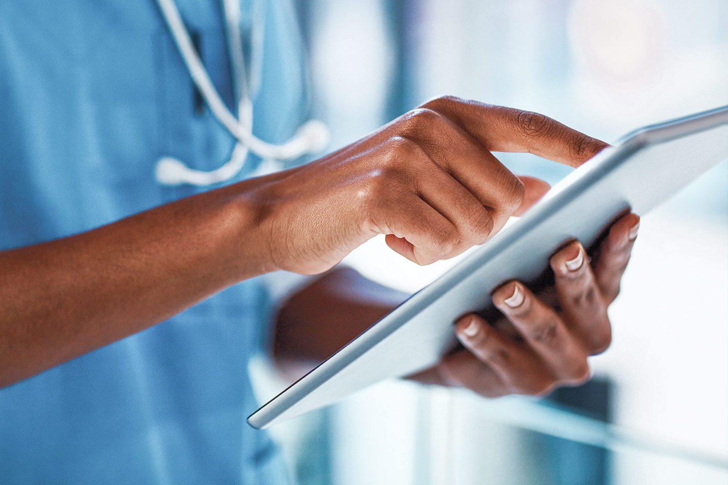 doctor using a medical disease app on an ipad
