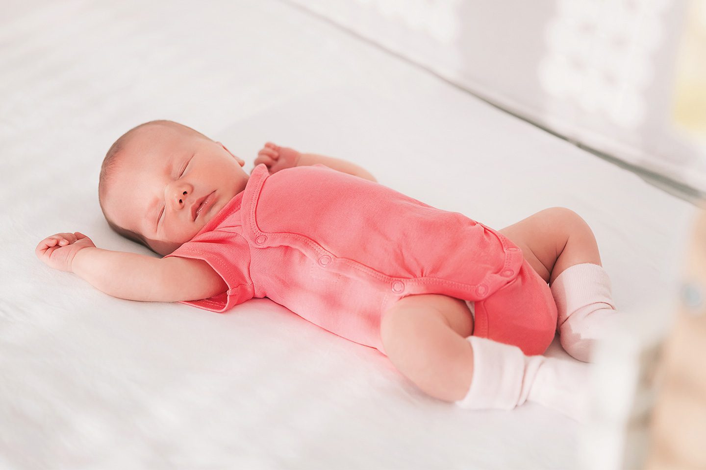 Sleeping baby in crib, safe sleep practices
