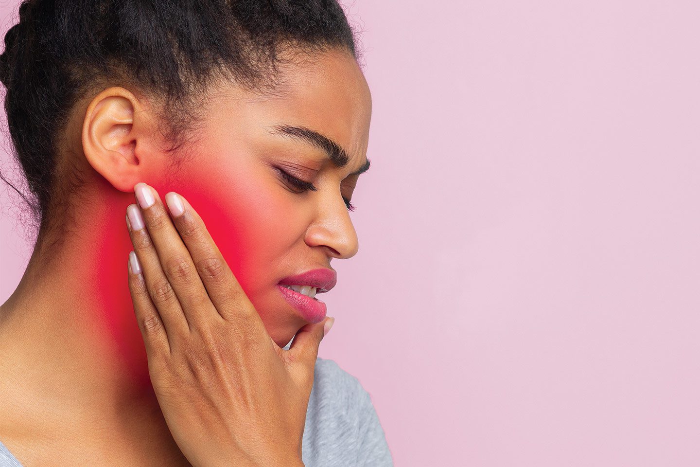 woman with jaw pain from periodontal health