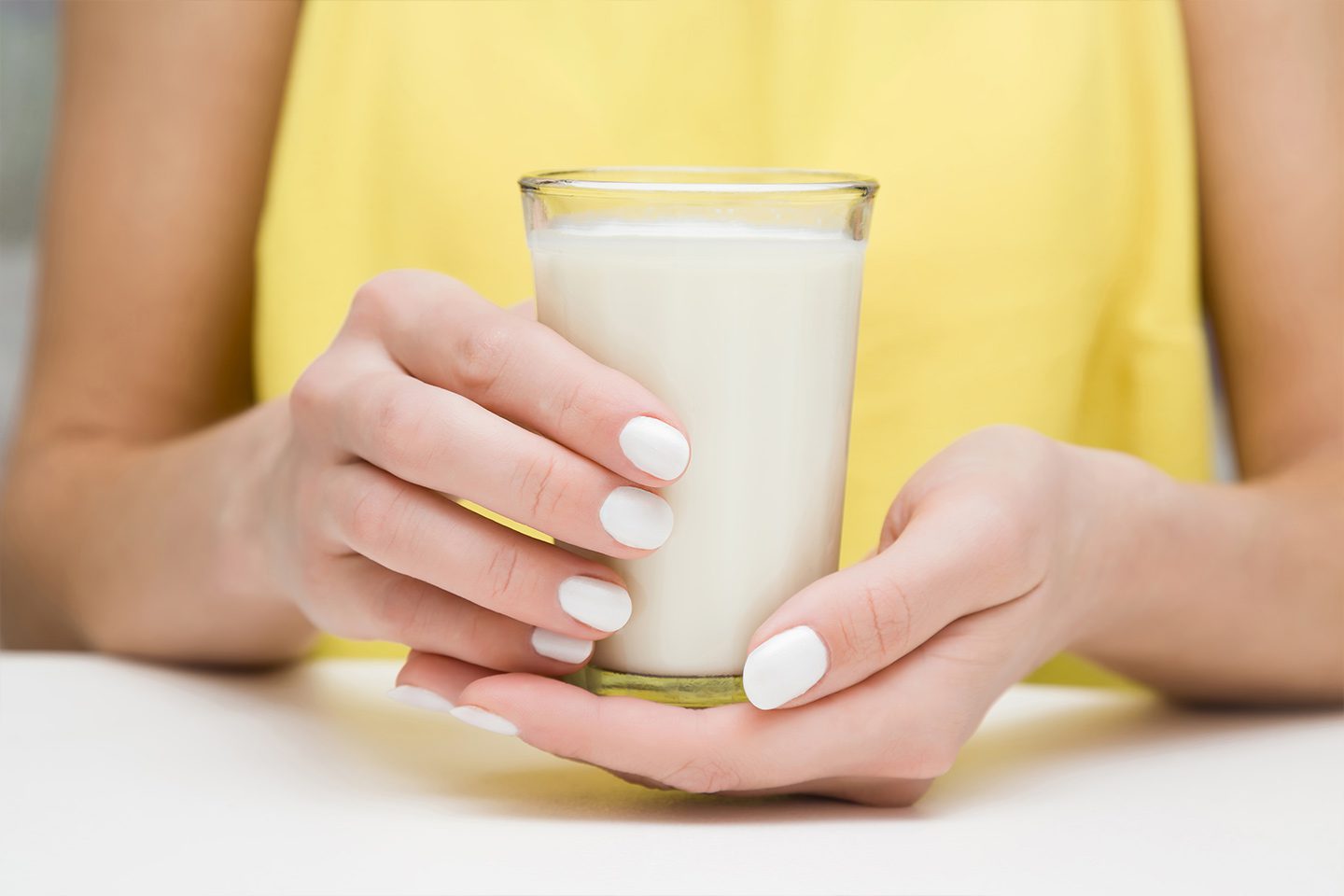 woman holding a glass of milk