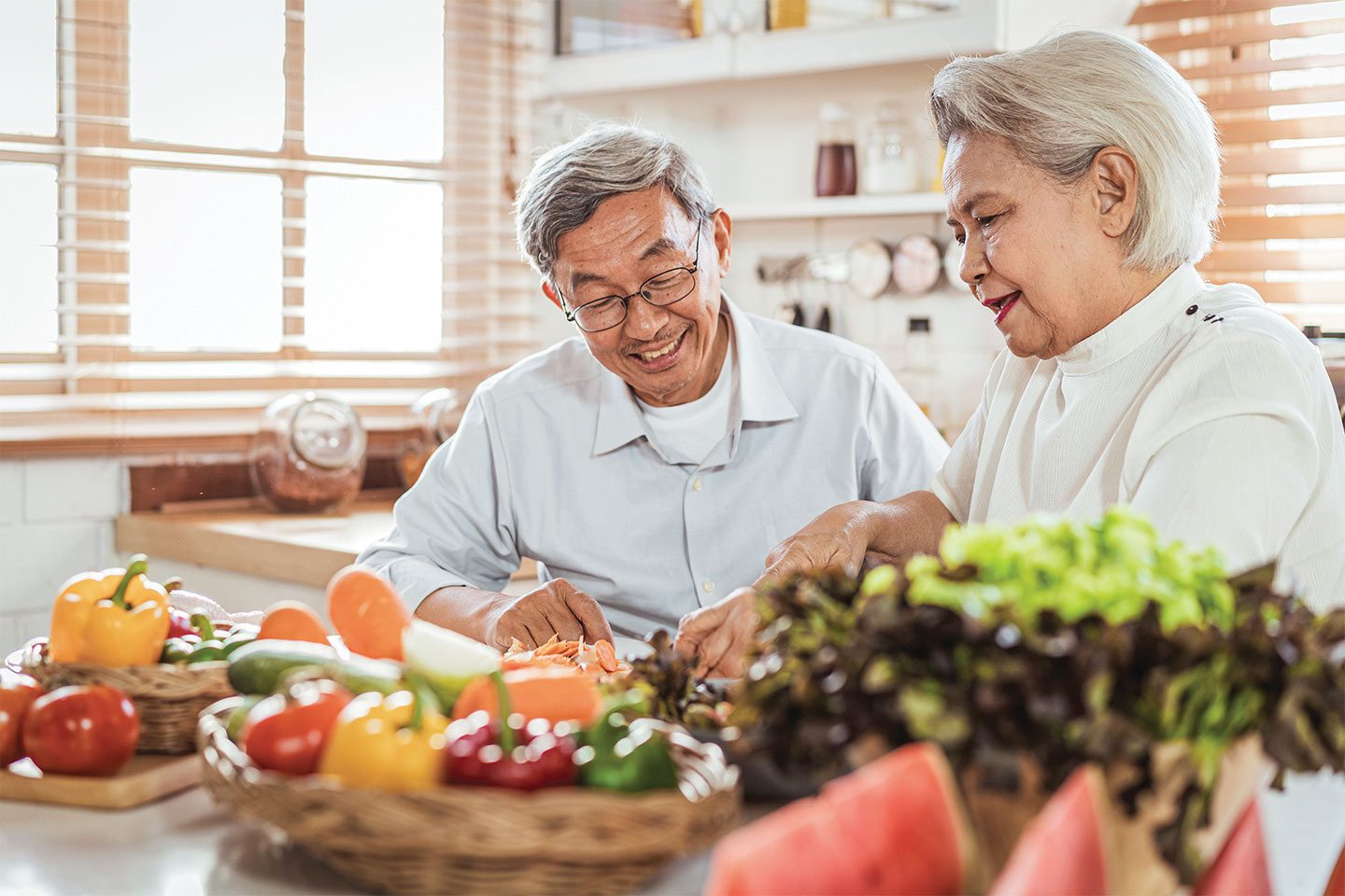 older couple preparing healthy meal together for brain health