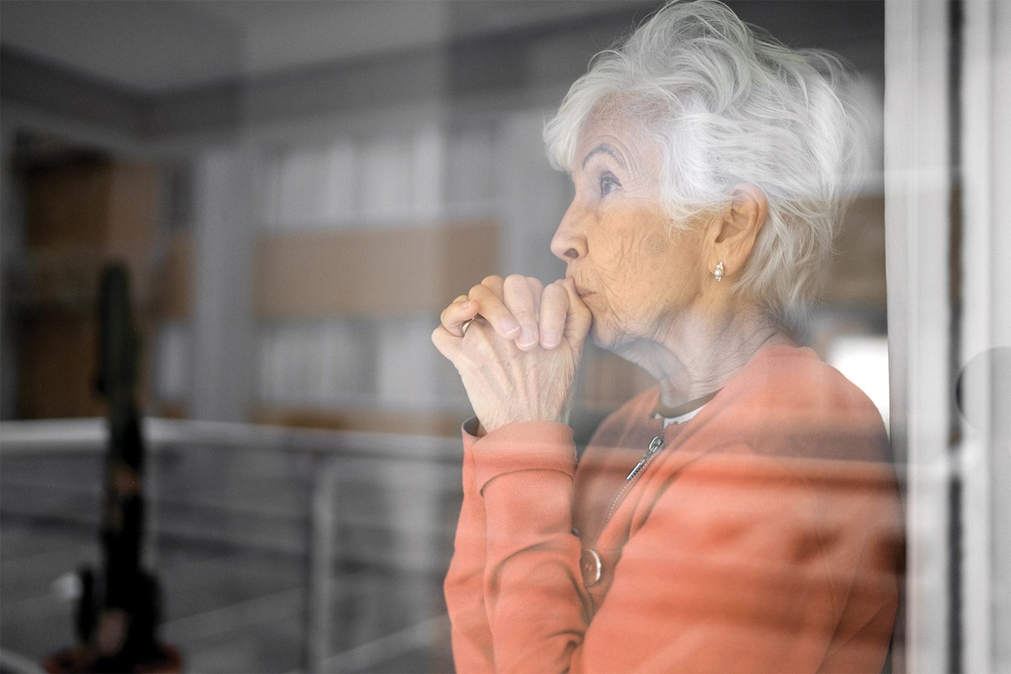 isolated senior woman with untreated hearing loss