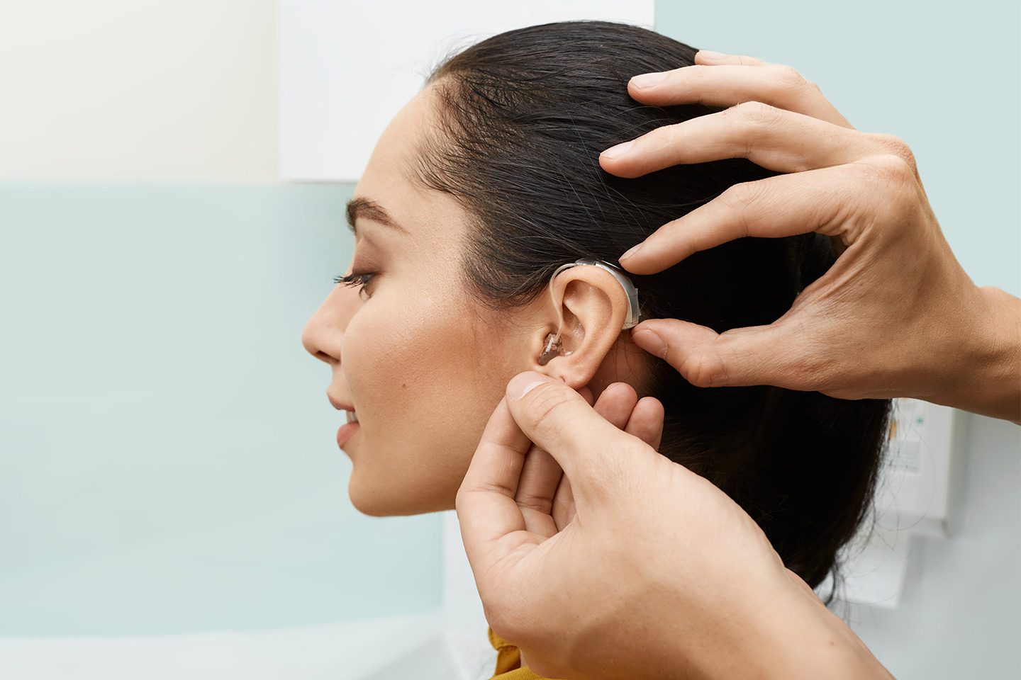 woman getting a hearing aid