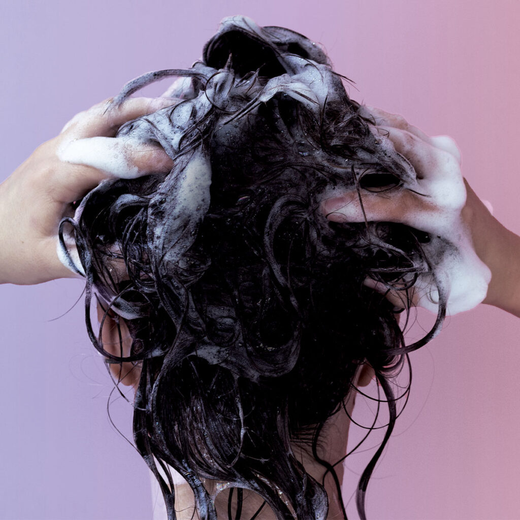 woman shampooing her hair