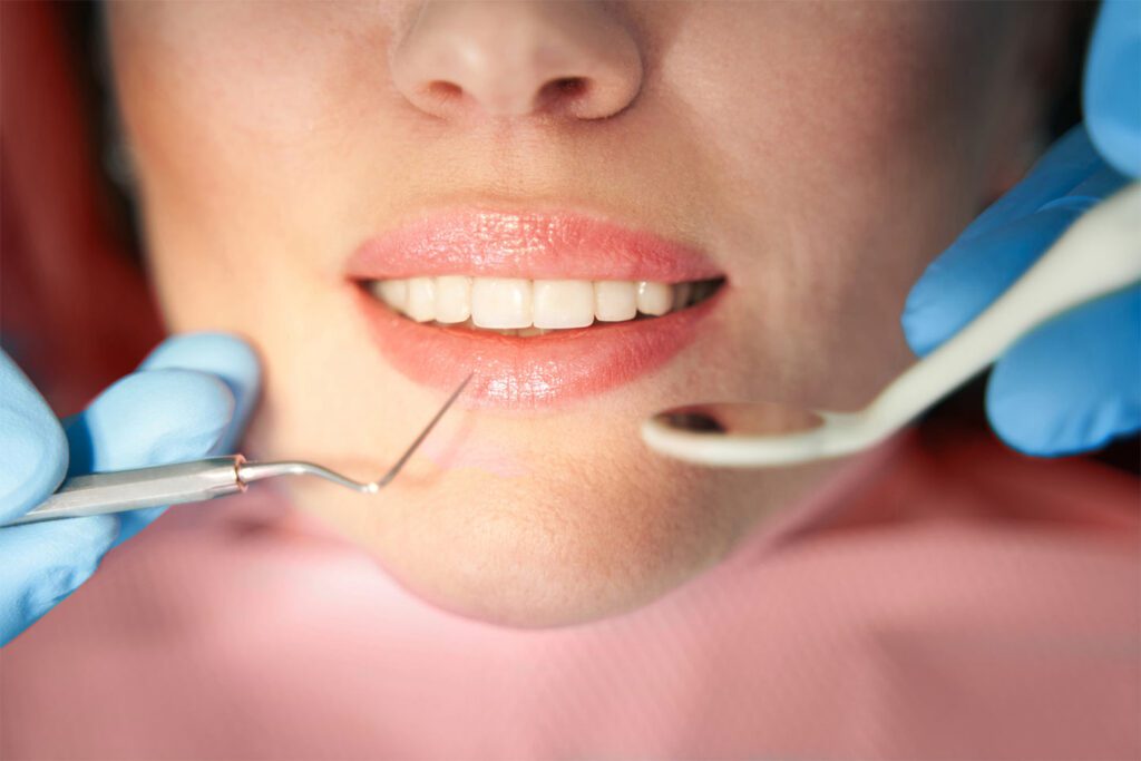 Woman having teeth checked