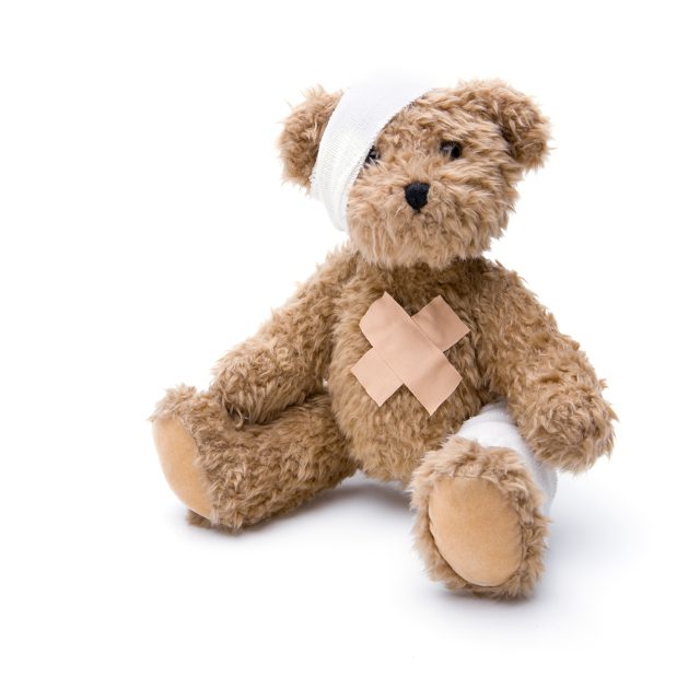 Bear with bandages to comfort a child that has pediatric cancer.