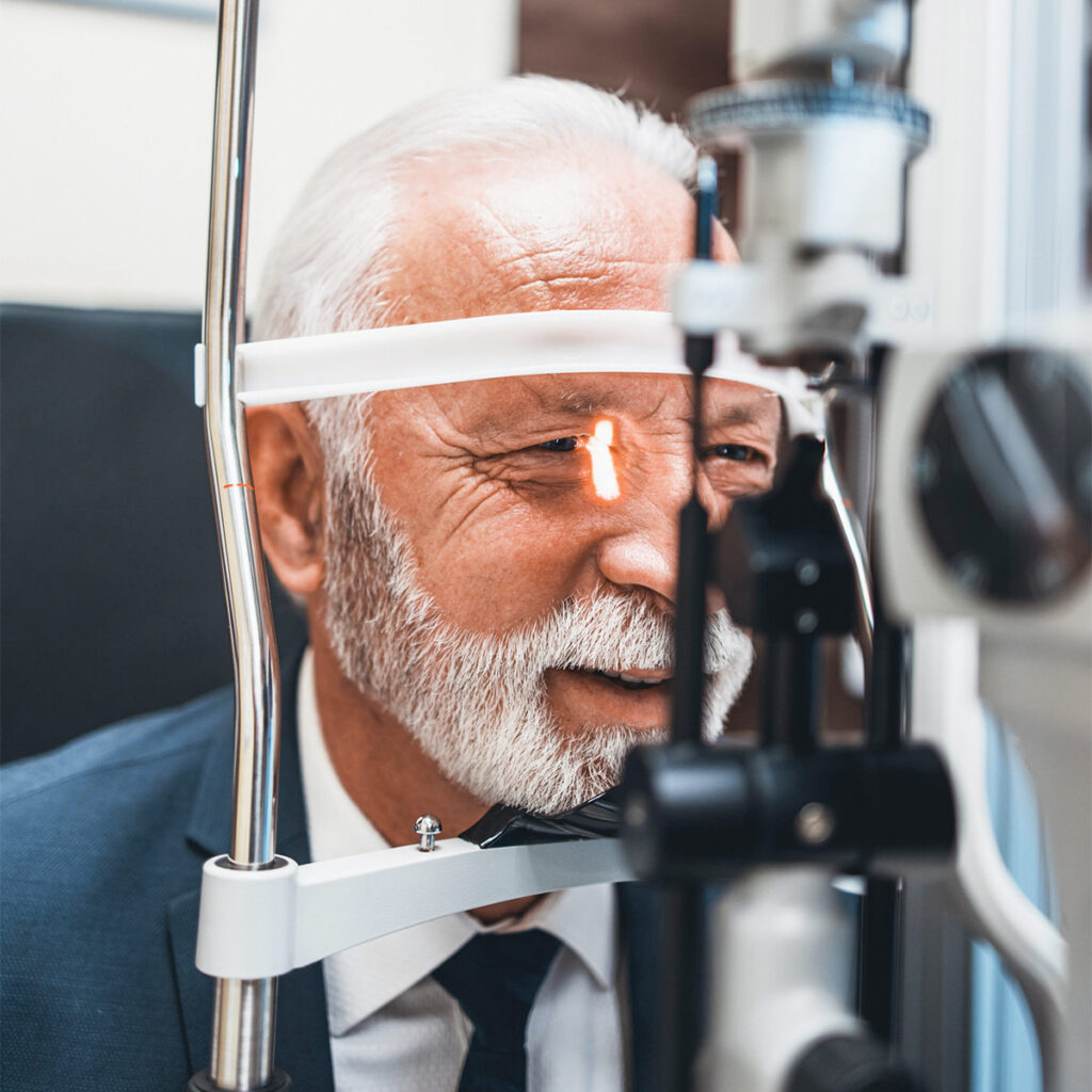 elderly man getting his eyes checked for cataracts