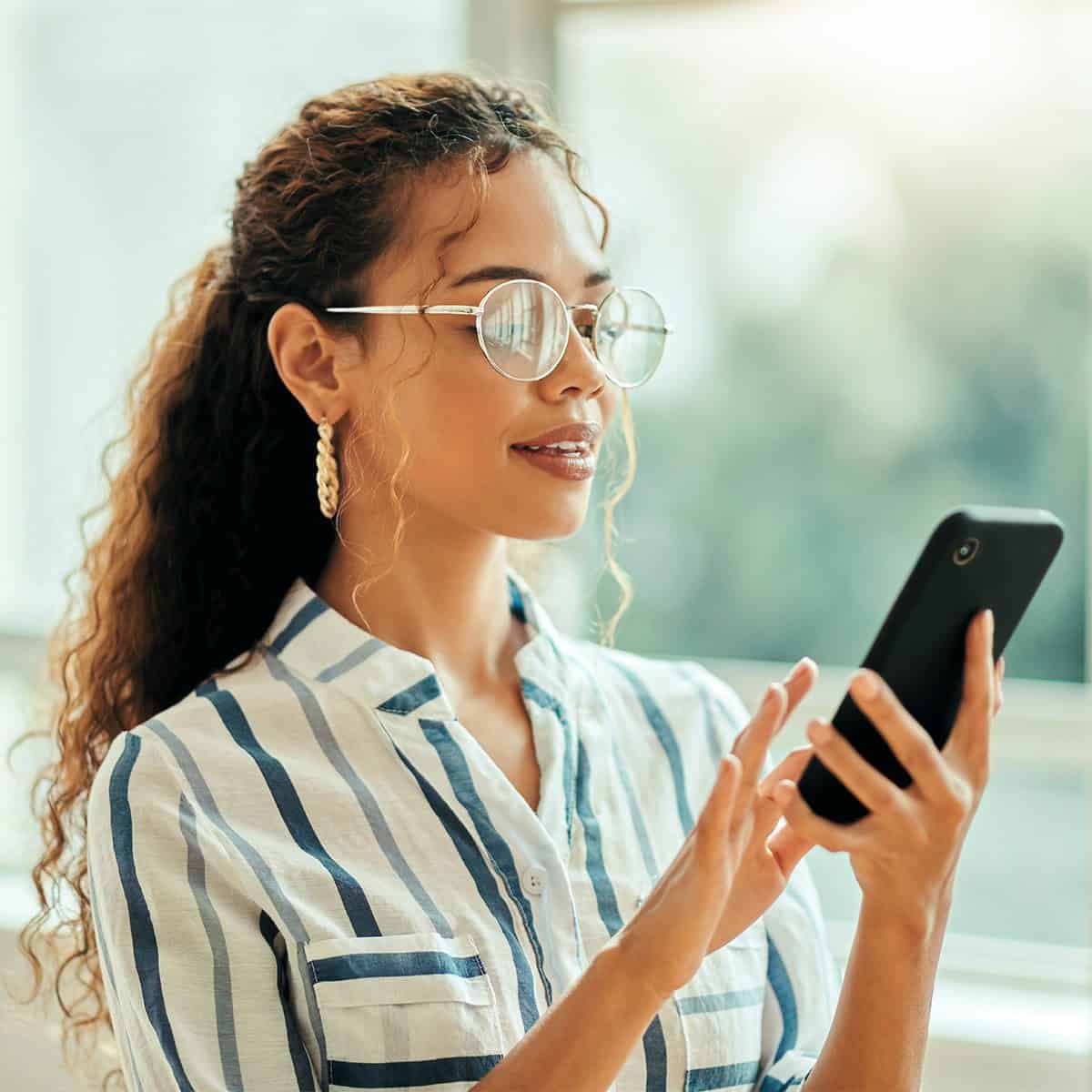 woman looking at social media on her phone