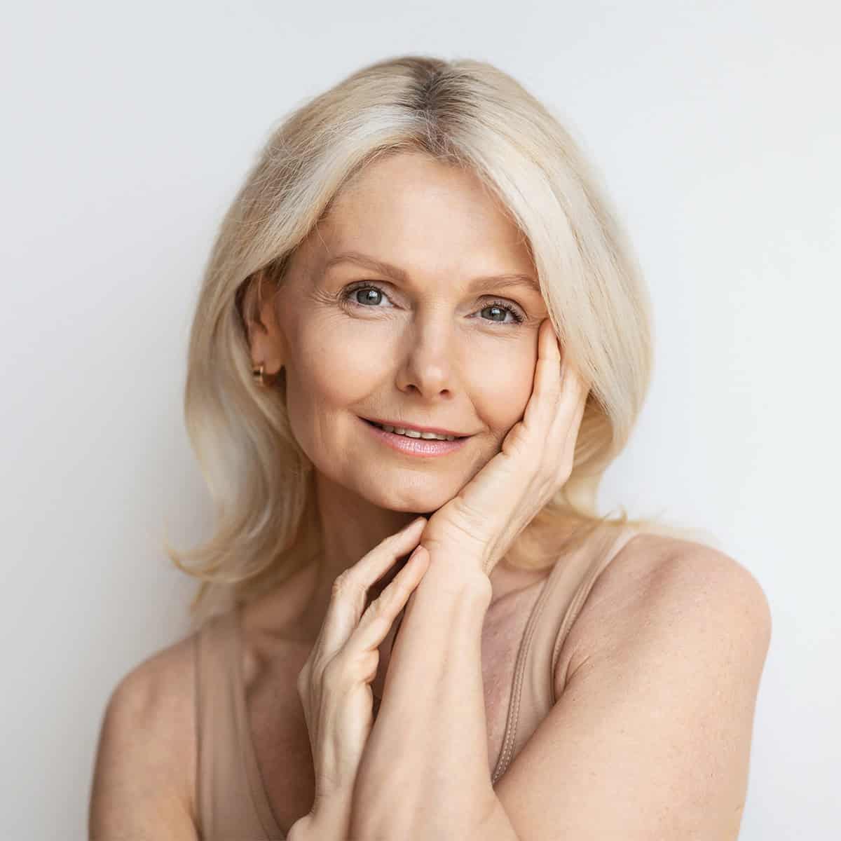 healthy older woman with aging skin treatments