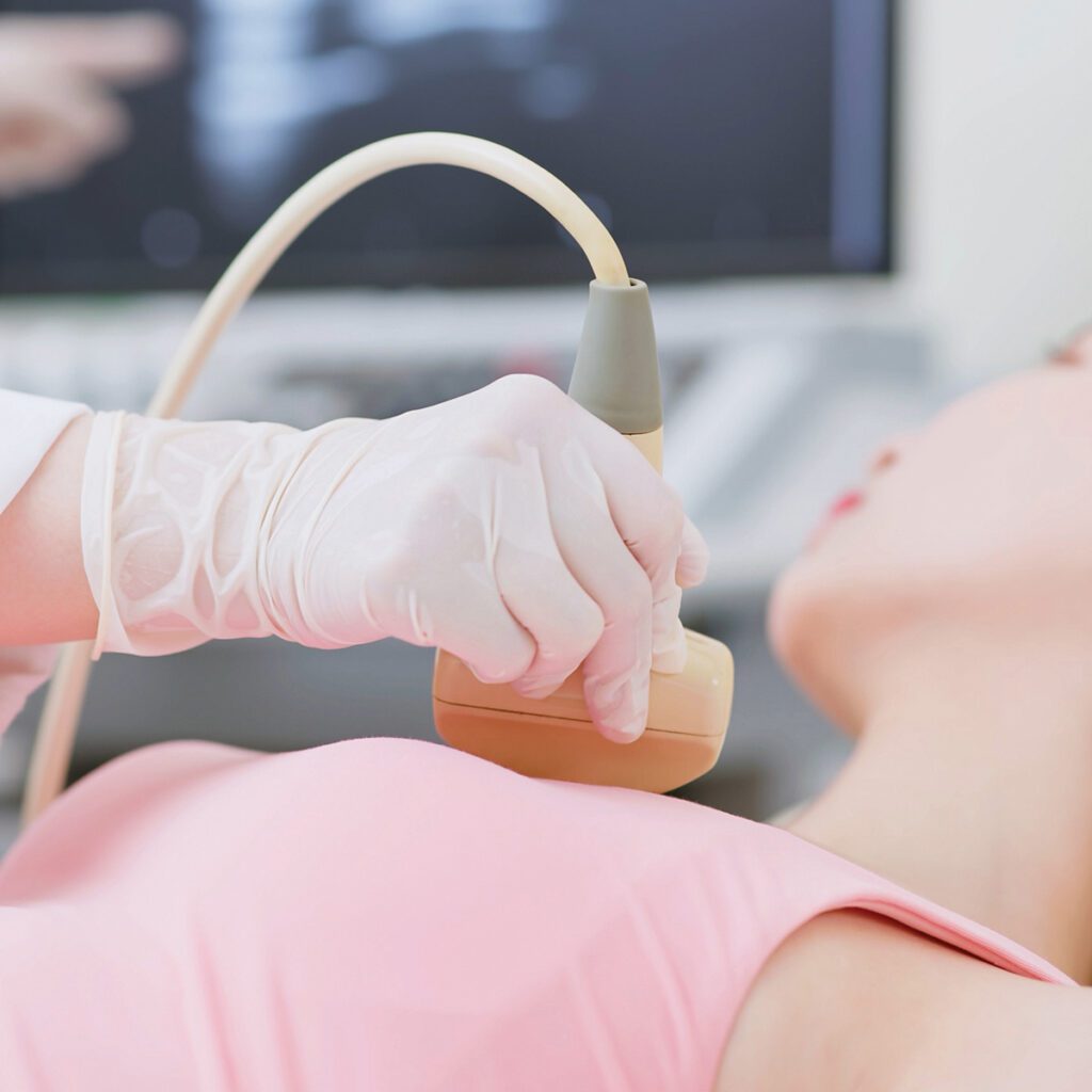 woman getting checked for breast cancer