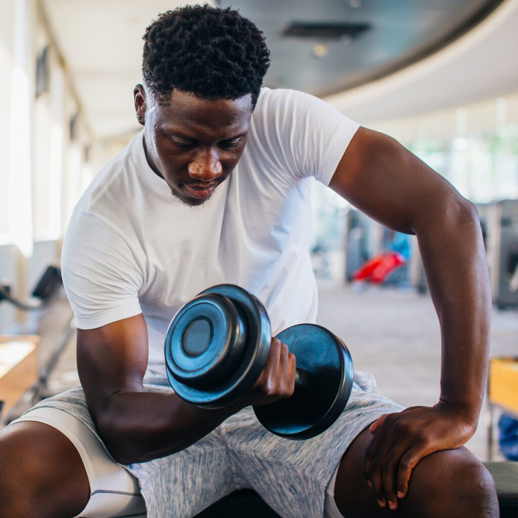 man lifting weights