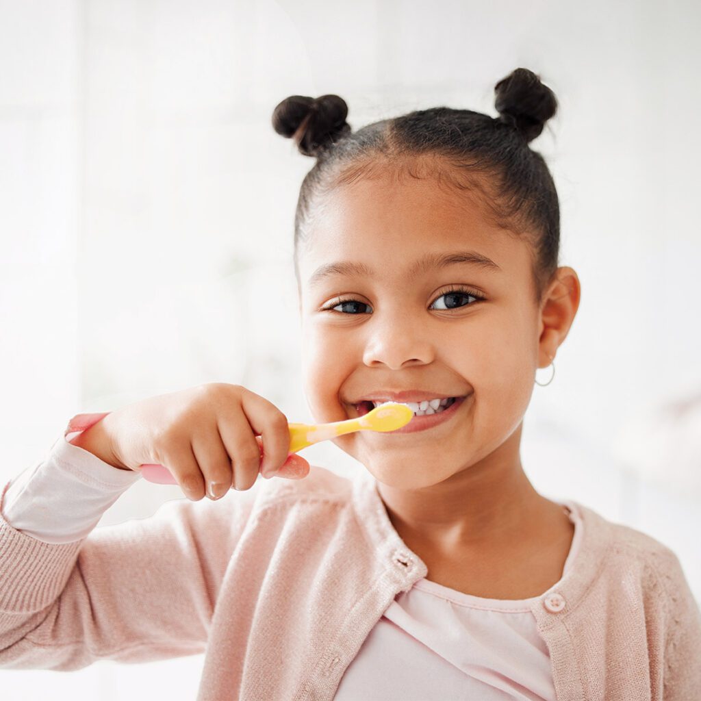 girl brushing her teeth