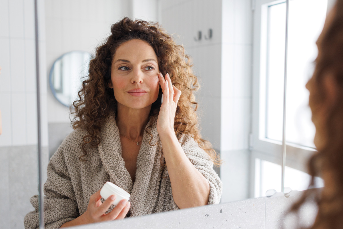 woman applying anti-aging skincare