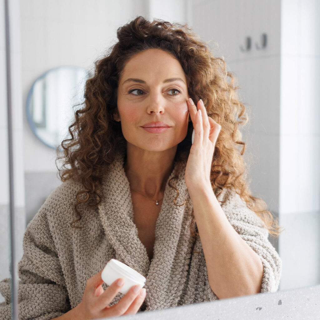 woman applying anti-aging skincare