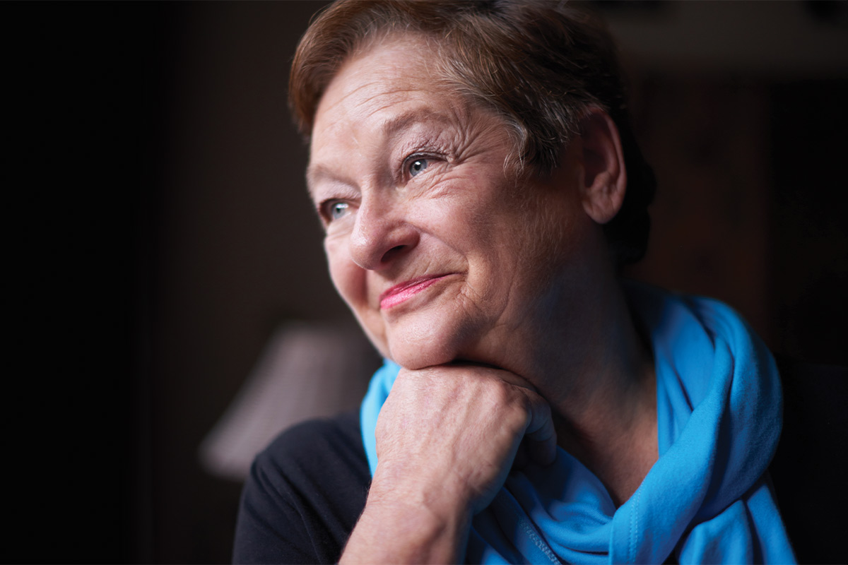 smiling older woman with visible veins
